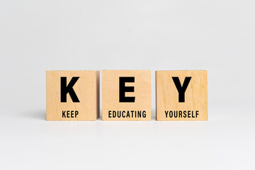 key acronym with keep educating yourself words text isolated on white background