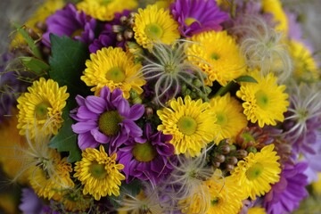 Bright and beautiful bouquet of yellow and purple flowers in full bloom.