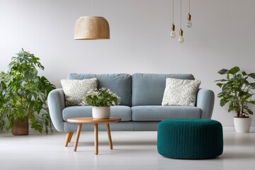 Living room scene with a gray couch plants a round table and hanging lights against a white wall