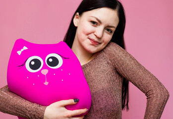 Girl teenager with a toy in their hands. Girl teenager with a happy, lovely face. Girl hugging a...