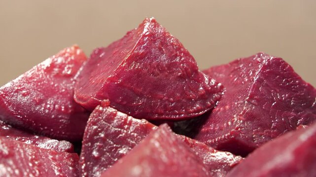 Boiled red beetroot cut into pieces, close-up shot