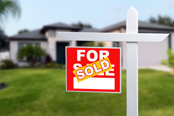 Sold Home For Sale Sign in Front of New House.