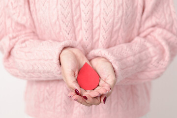 Adult woman with red Blood drop paper for concept of June World Blood Donor day, Donation, April...