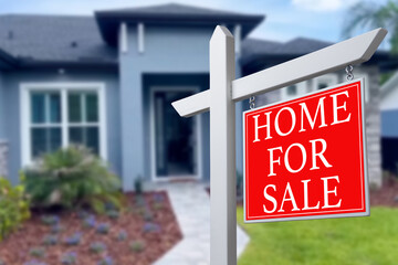 Home For Sale Real Estate Sign and Beautiful New House.