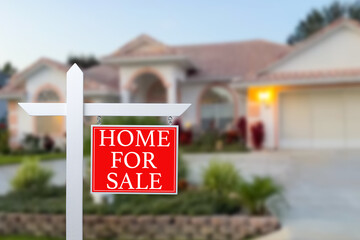 Home For Sale Real Estate Sign and Beautiful New House.