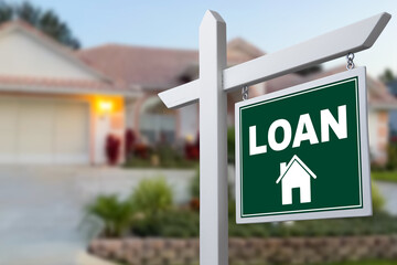 LOAN sign against a house. Close-up.