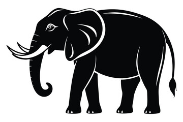 Majestic black elephant standing calmly displaying its long curved tusks and large ears