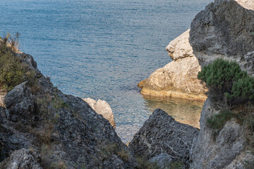 Rocky coast of Black Sea. Coastal scene with steep cliffs and large boulders of Cape Alchak rises...
