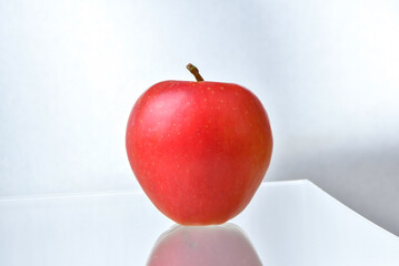 Red Apple on Wooden Table.