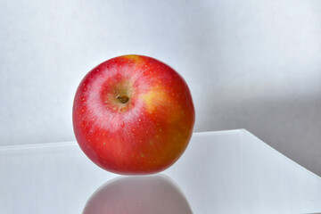 Red Apple on Wooden Table.
