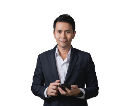 Professional man in formal attire holding smartphone, standing confidently with a focused expression against a white background for business concepts