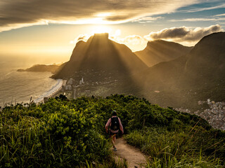 Golden Sunset Over Rio De Janeiro From Two Brothers Mountain: Dramatic Sunbeams Streaming Through Coastal Peaks Above The Atlantic Ocean And Leblon Beach