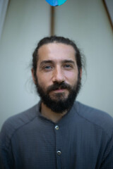 Obraz premium portrait of a man with bun and beard