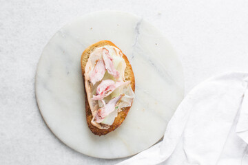Overhead view of open sandwiches with chicken yellow tomatoes and peppers, top view of sandwich appetizer
