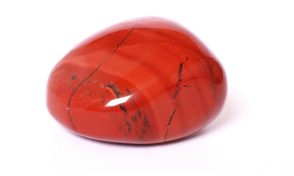 Image - A single polished red carnelian stone isolated on a transparent background.