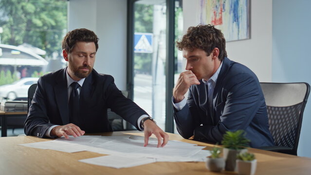 Business partners discussing agreement reading deal at office meeting closeup - Powered by Adobe