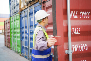 Customs clearance officer or shipyard engineer is inspects against the import - export cargo...