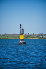Close up shot of a navigational buoy at a port entrance.
