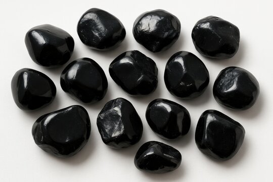 Collection of Apache Tear Obsidian Mineral Samples on White Surface