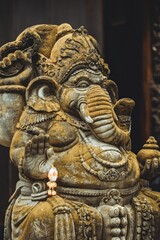 Ancient Ganesha statue with intricate details in traditional Hindu style