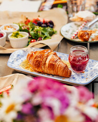Fragrant croissant breakfast in a cozy old town on the summer terrace of an atmospheric cafe in...