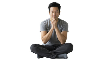 Thoughtful Asian man sitting cross legged on white background