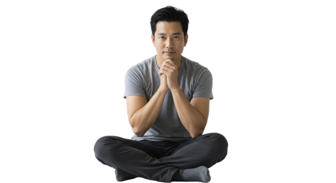 Isolated Asian Man Sitting Cross Legged with Hands Clasped Looking at Camera