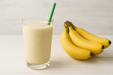 Creamy banana beverage on a rustic wooden surface with empty space for text
