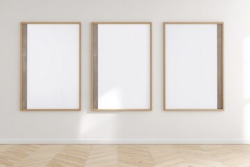 Three blank vertical wooden frames hanging on white wall in modern room