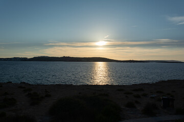 Golden Light Over Coastal Landscape at Dusk