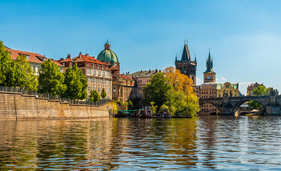 A view from the Vltava river towards the east end of the Charles Bridge in Prague in springtime