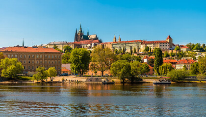A view from the Vltava river towards the castle complex in Prague in springtime
