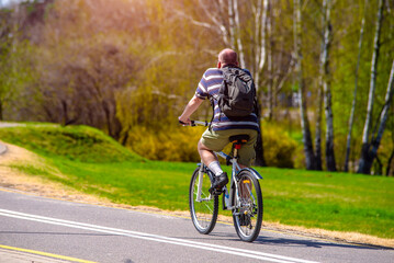 Cyclist ride on the bike path in the city Park