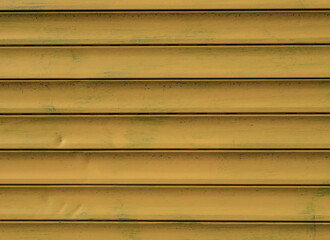 Yellow metal siding texture with horizontal panels and subtle dents. Industrial surface ideal for...
