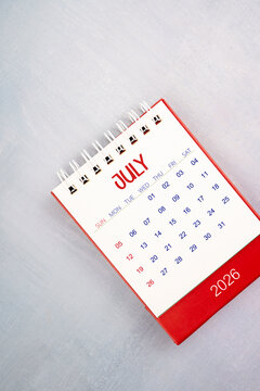 July 2026 on gray color wooden table, Flat lay.