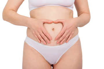 Woman making heart shape on her belly with her hands. Healthy digestion and gynecological health concept. Self-care and body awareness.