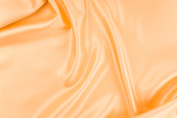 Smooth elegant orange silk can use as background.