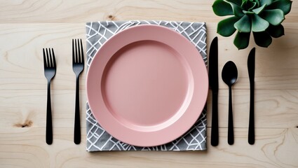 Close-up top view of serving an empty pink plate, with a knife and fork placed on a folded linen napkin featuring a geometric pattern. Selective focus. Mockup, copy space, minimalist style.
