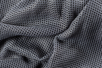 Synthetic polyester fabric macro top view, gray fabric background