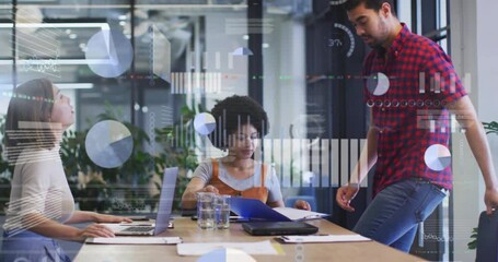 Man placing folder on table prompts colleagues reviewing folder, floating data charts for analysis - Powered by Adobe