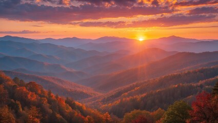 Vibrant fall dawn illuminating the misty mountain range
