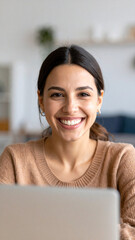 Happy young woman using laptop sitting at desk writing notes while watching webinar, studying online, looking at pc screen learning web classes or having virtual call meeting remote working from home.