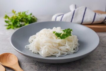 small noodles, thin rice noodles in grey plate 
