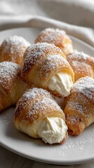 Flaky croissants filled with creamy vanilla custard and topped with powdered sugar, perfect for a delightful breakfast treat.