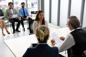 Obraz premium Human resources : company, successful deal. Human resources manager interviewing applicant at modern office. Asian woman candidate job interviewing and answering question hr CV recruiter