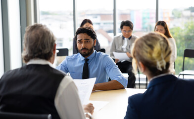 Human resources : company, successful deal. Human resources manager interviewing applicant at modern office.  Indian man candidate job interviewing and answering question hr CV recruiter