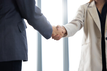 businesswoman shaking hands on business cooperation agreement. Successful Asian business female...