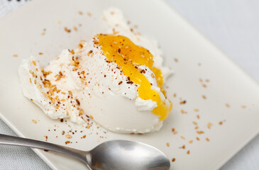 Homemade hearty breakfast - cottage cheese with honey sauce. dish is richly decorated with sesame...