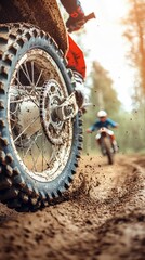 Dirt bike racing on a muddy trail