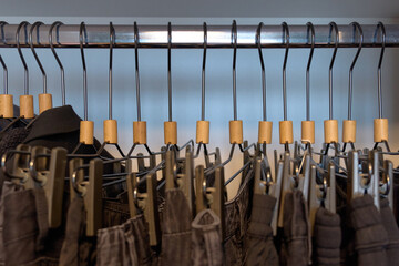 Stylish clothing arranged on hangers in a boutique